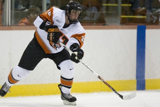 men's hockey player skating during a game.