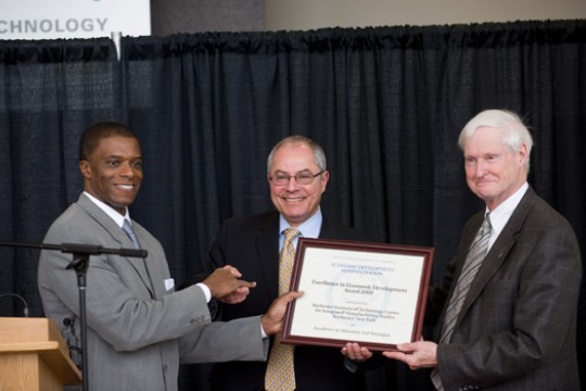 Person accepting award on stage