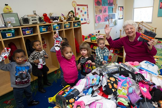 Teacher posing with students