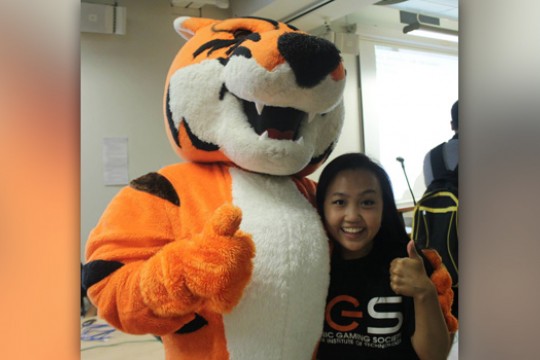 Person posing with mascot