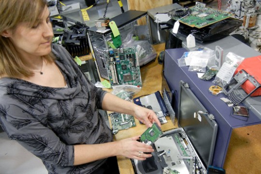 People working on computer parts