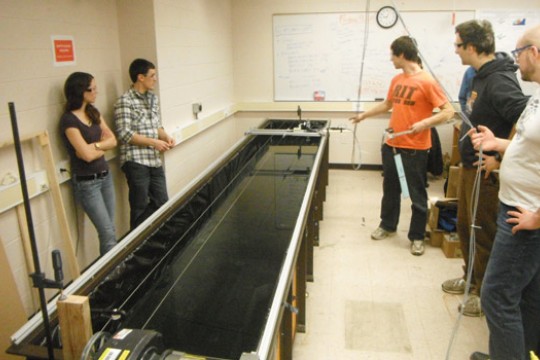 Students standing around display