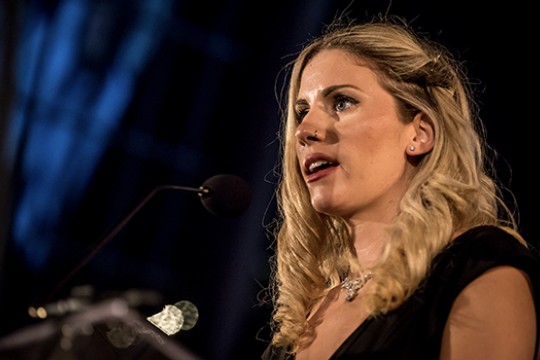 person speaking at a podium.