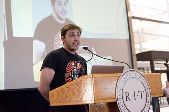 Student speaking at podium 