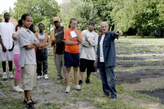 Person leading students and other people on tour 