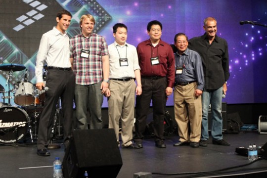 People posing on stage