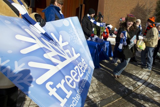 Picture of person holding FreezeFest banner