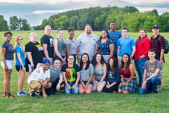People gathered for picture on field