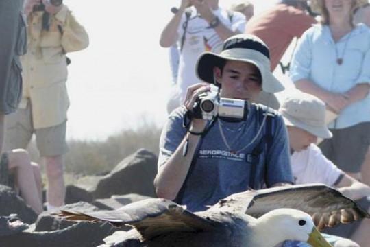 Student Photographing Bird