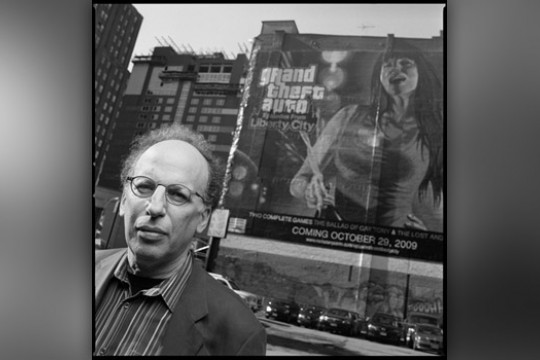 Person posing in front of sign