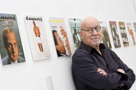 Person posing with magazines