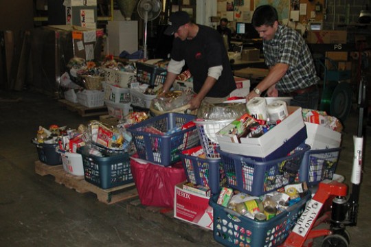 People putting food in containers