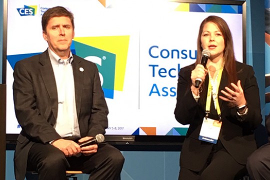 Two people talking on stage at event