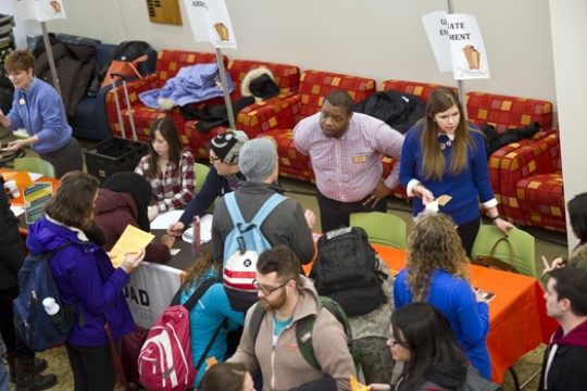People speaking at tables