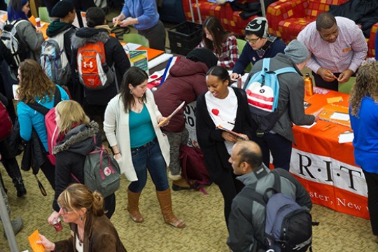 People walking around fair 