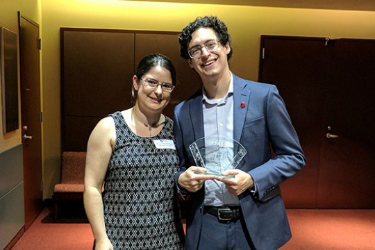 Two people posing for camera