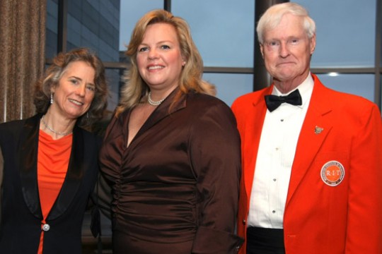 Three people posing together