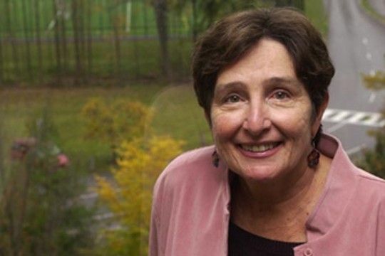 Professor standing in front of window