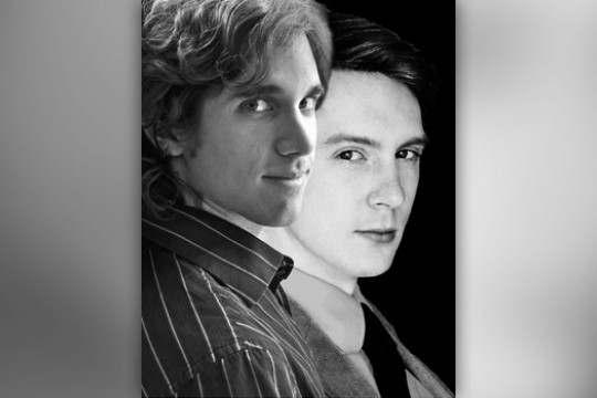 Two people posing for camera