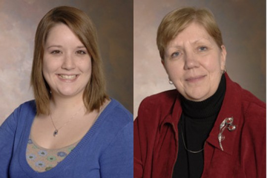 Two people posing for camera