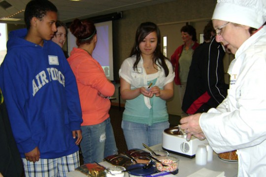 People getting food at table