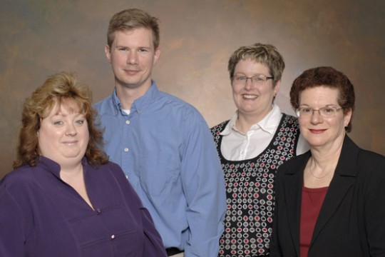 People gathered posing together