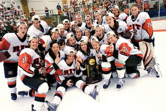 Players gathered around award