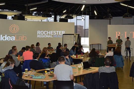 People watching presentation in large classroom
