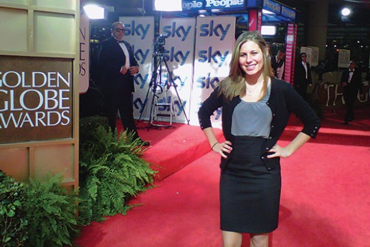 Person posing on red carpet