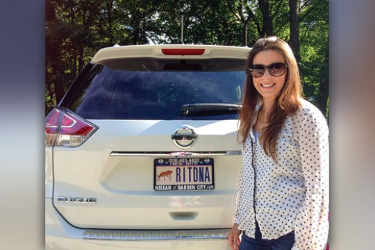 Person posing with car