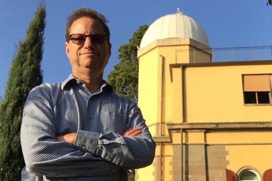 Scientists posing in front of observatory