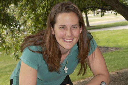 Student posing for camera outisde