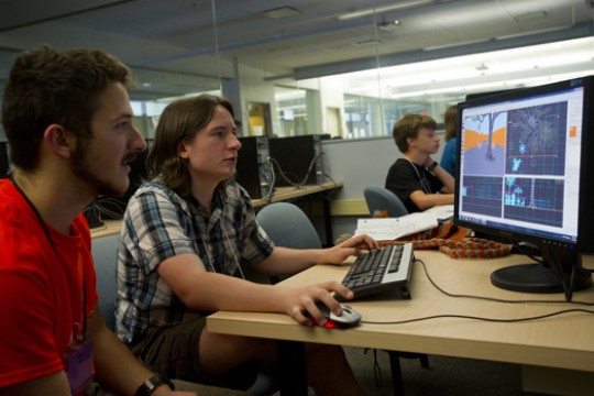 People working on animation on computer