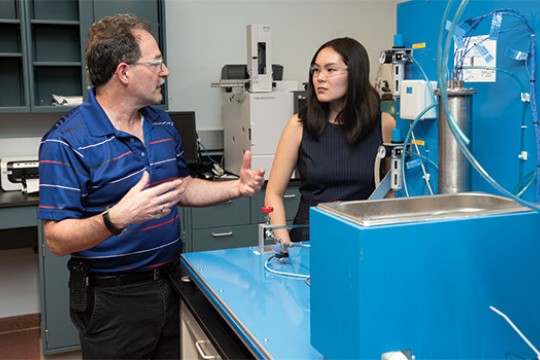 Student and Professor working in lab