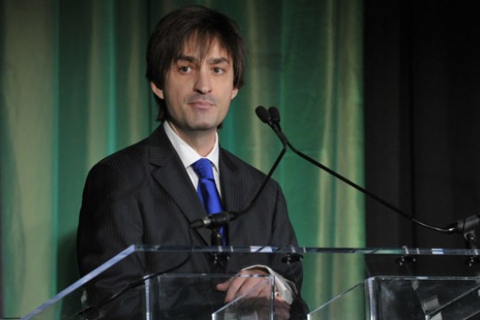 Person standing behind podium