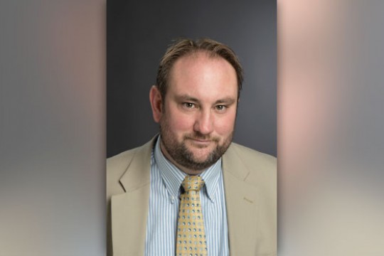 Professor posing for camera