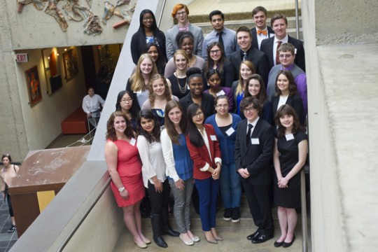 People dressed up posing on staircase