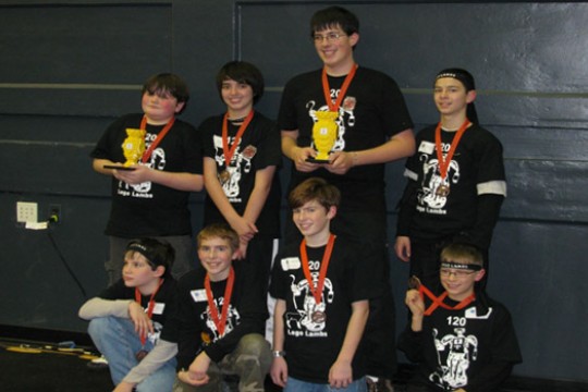 Kids posing with award