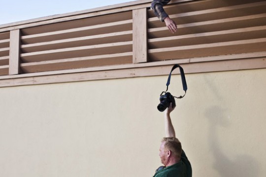 Picture of person handing camera to someone