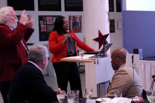 Person giving speech at podium