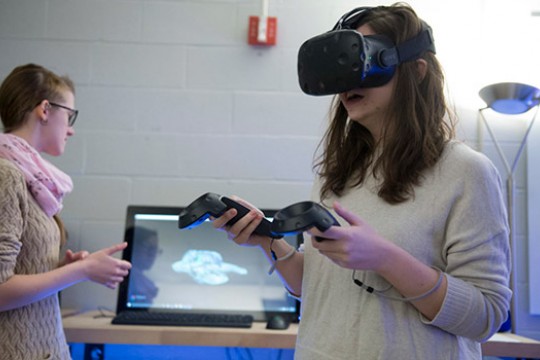 Person using virtual reality device in classroom