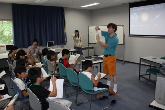 Person teaching kids