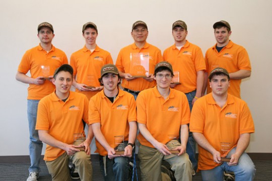 Team posing with camera