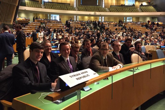 People gathered at long table for conference