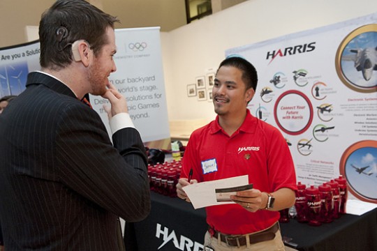 Student talking to person at career fair