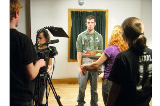 Person posing in exhibit