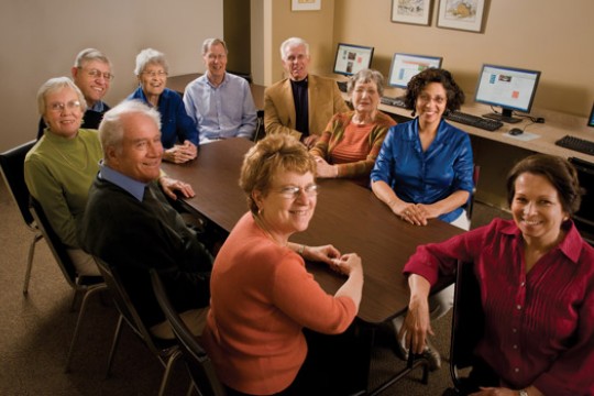 People posing for camera at table