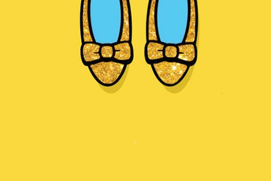 Yellow glittery flat shoes with bows on them.