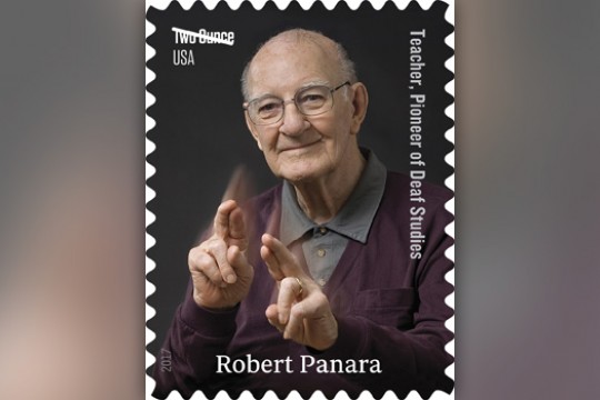 Picture of person signing on stamp
