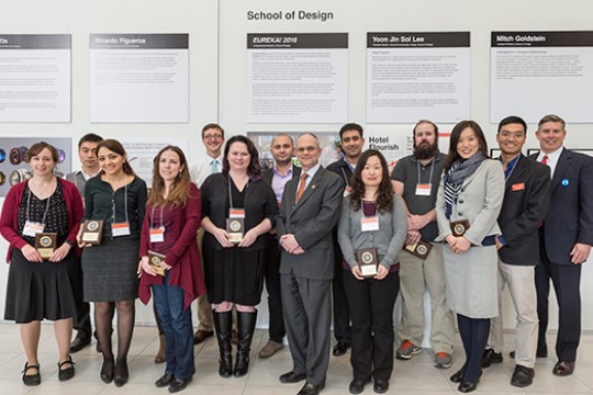 People posing in front of posters